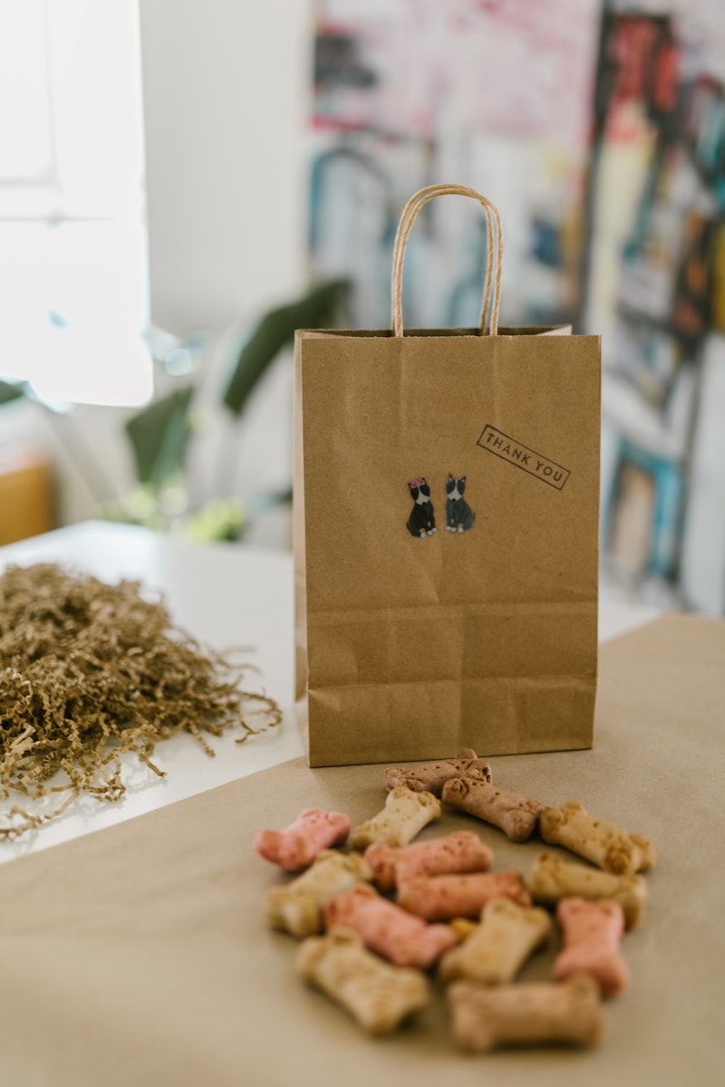 Dog Treats and a Paper Bag with Thank You Text