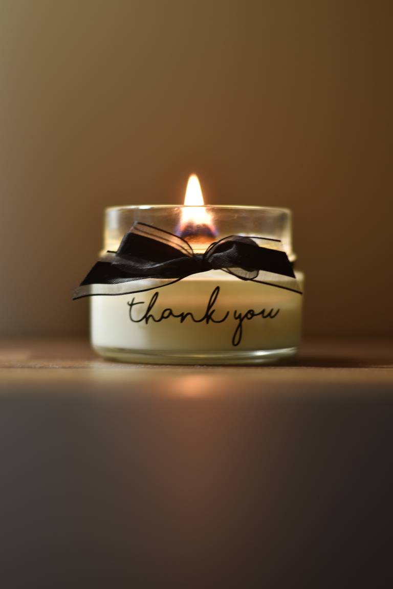 White and black candle holder with Thank You text